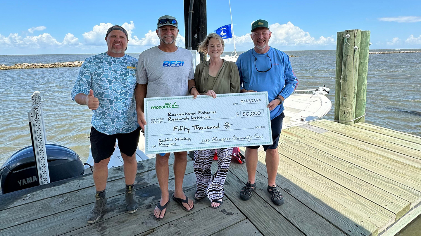 Danna Leblanc, commercial executive director for the Louisiana Clean Energy Complex, presents a check from Air Products to RFRI.