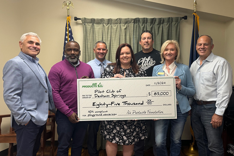 Air Products employees join members of the Denham Springs Pilot Club for a check presentation.